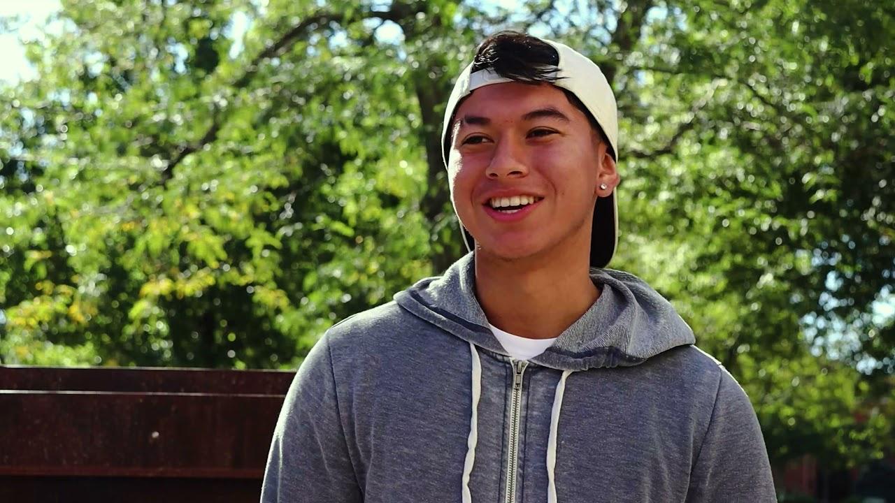 student with hat backwards